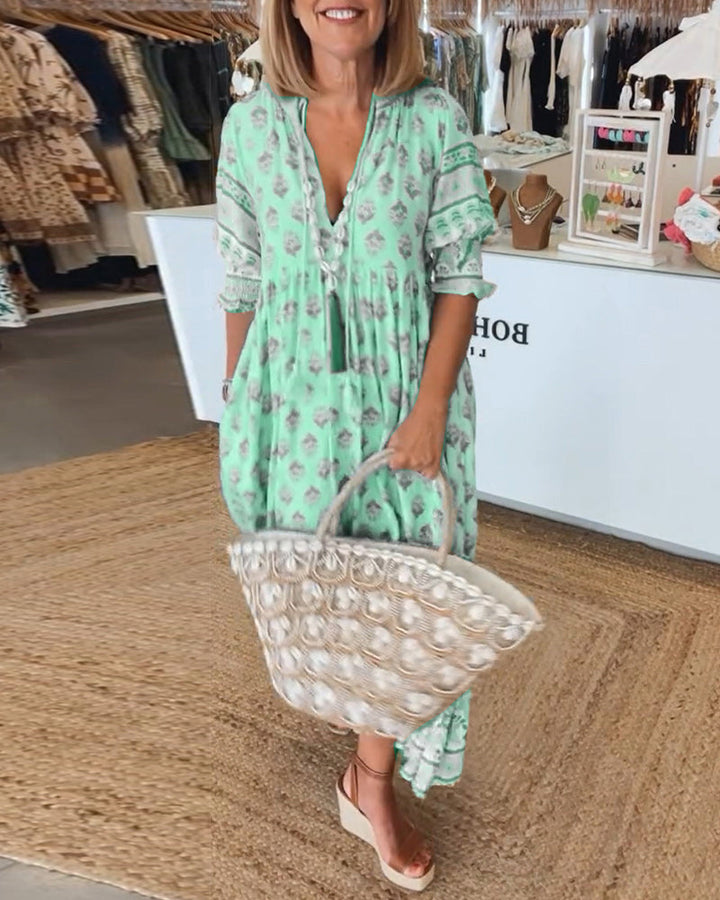 Stylish women's V-neck printed midi dress, bohemian style with chic lantern sleeves, a must-have.