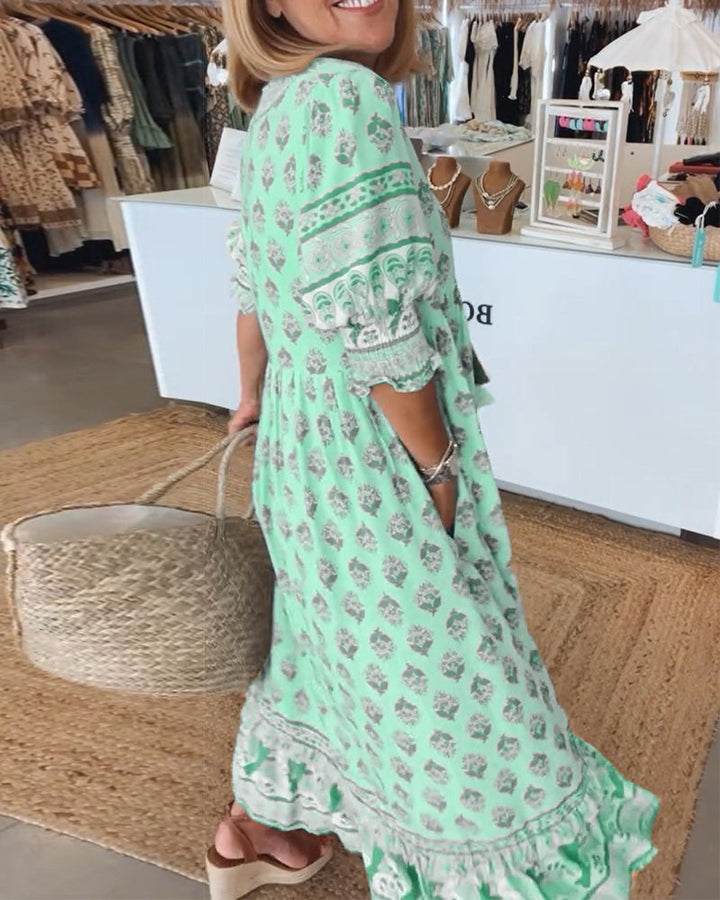 Loose fit, flowy women's printed midi dress, bohemian design with unique lantern sleeves and elegant print.