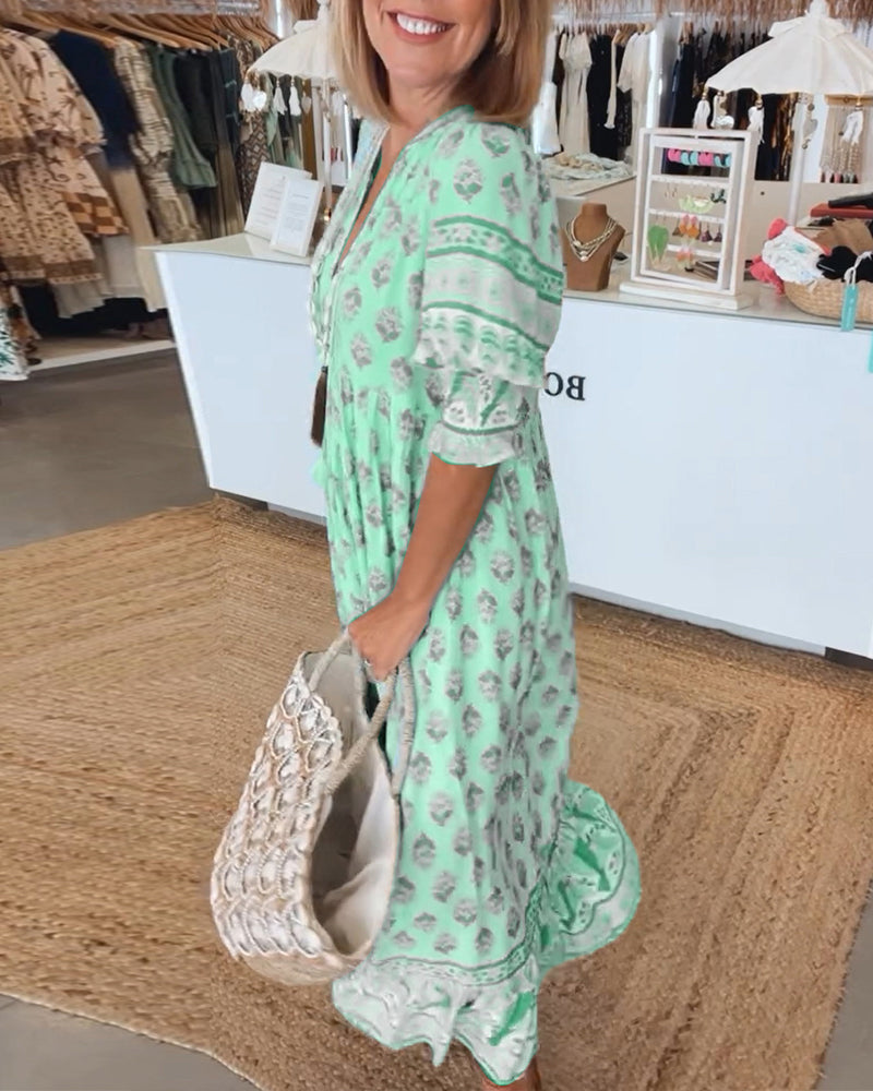 Vibrant women's spring/summer printed midi dress, boho chic with elegant lantern sleeves.