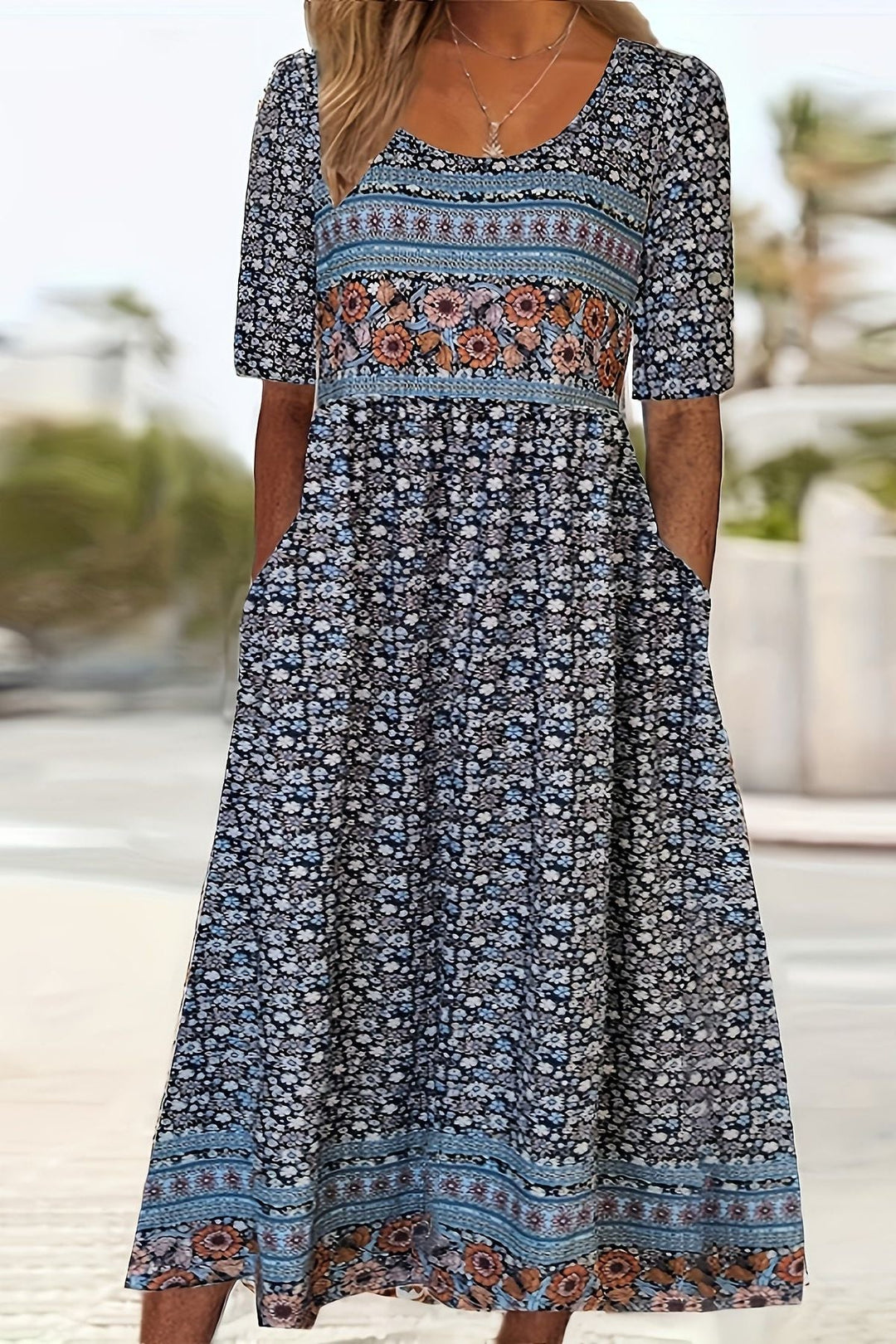 Casual women's relaxed fit midi dress featuring a vibrant print, great for summer and effortless style.