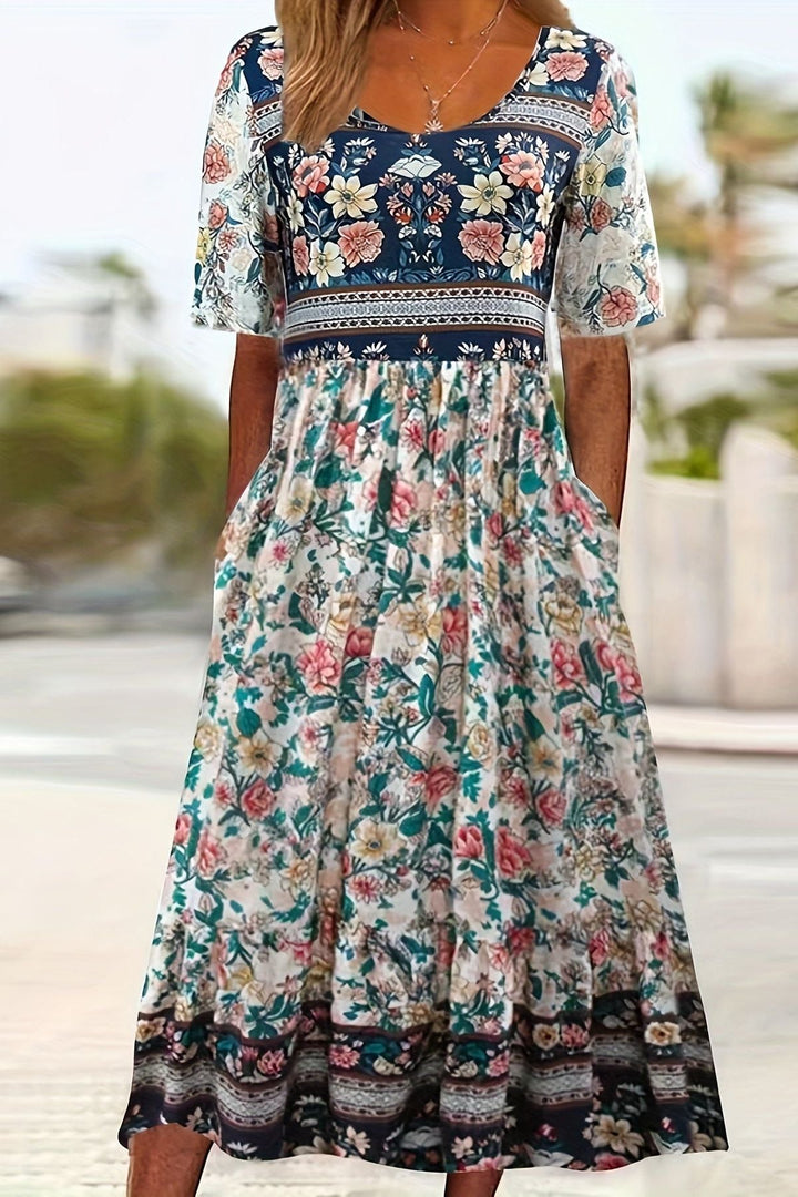 Elegant women's printed midi dress with a relaxed fit, offering versatile and comfortable everyday fashion.