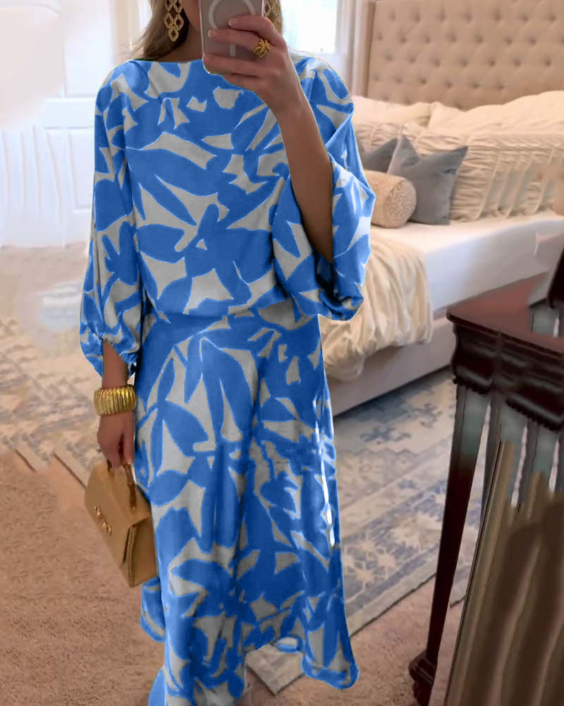 Detailed view of the women's printed two-piece set fabric, highlighting pattern and lantern sleeves.