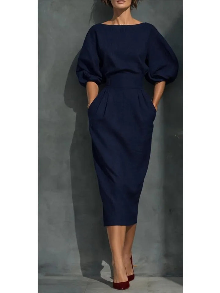 Elegant midi dress for women featuring chic puff sleeves and convenient side pockets.