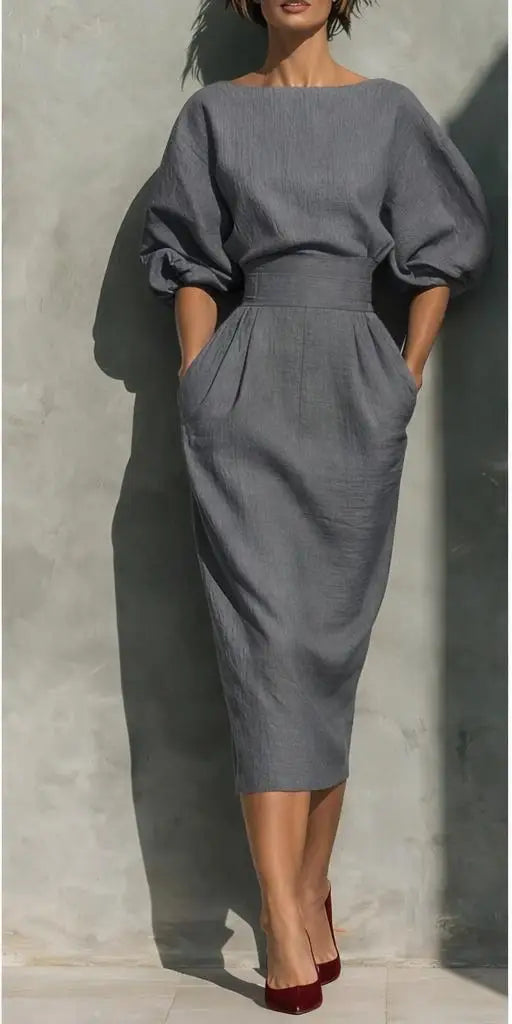 Fashionable women's puff sleeve midi dress with pockets, ideal for both casual & elegant looks.
