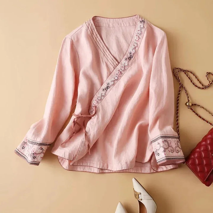 Women's purple patterned blouse, relaxed fit, elegant embroidery & V-neck.