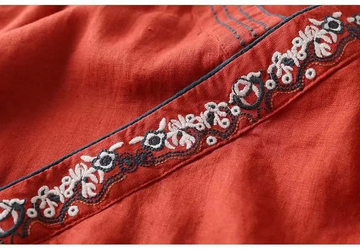 Stylish navy patterned blouse, women's relaxed fit, V-neck & embroidery.