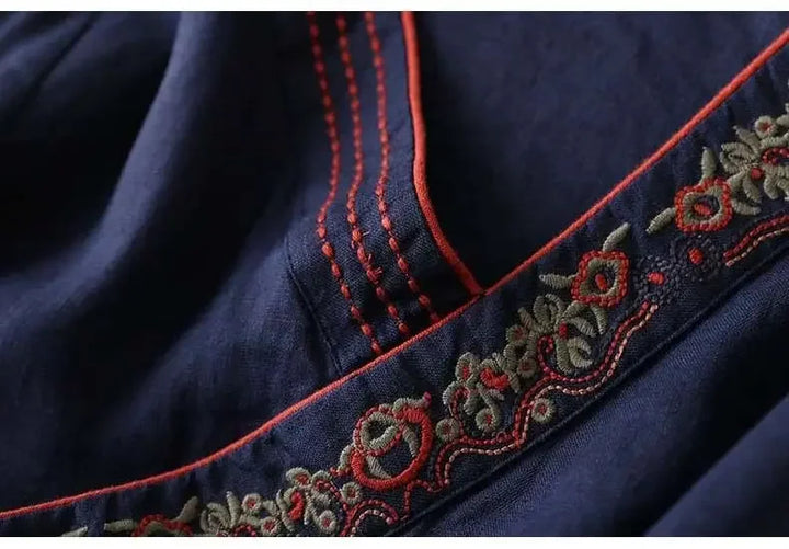 Red women's patterned top, relaxed fit, V-neck, delicate embroidery.