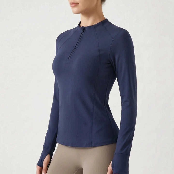 Stylish women's quarter-zip athletic top, a versatile long sleeve for various sports and workouts.