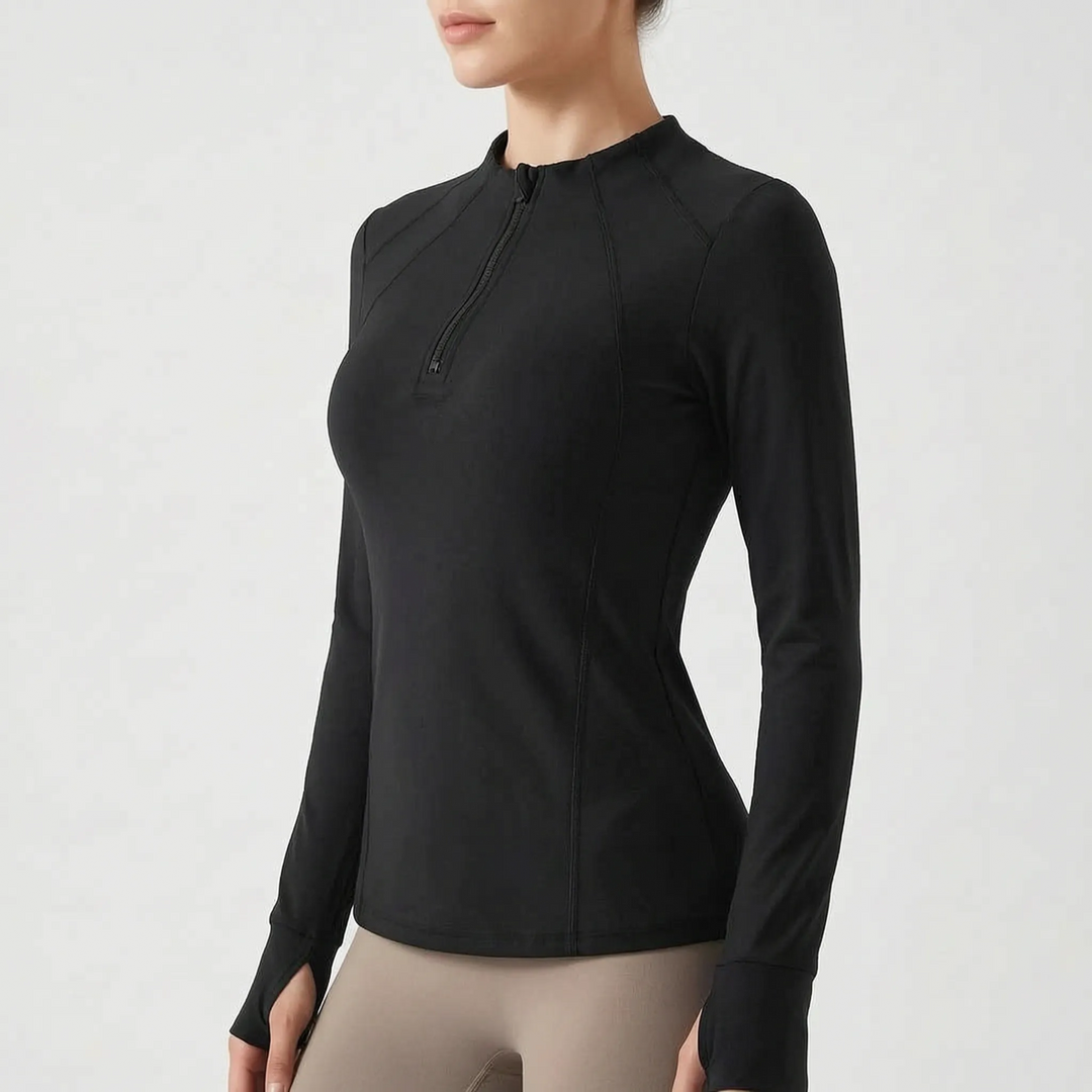 Folded women's quarter-zip activewear top, showing soft fabric and design for comfortable fitness.