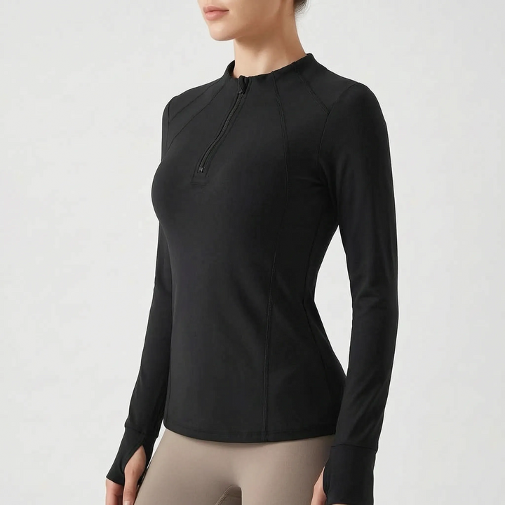 Folded women's quarter-zip activewear top, showing soft fabric and design for comfortable fitness.