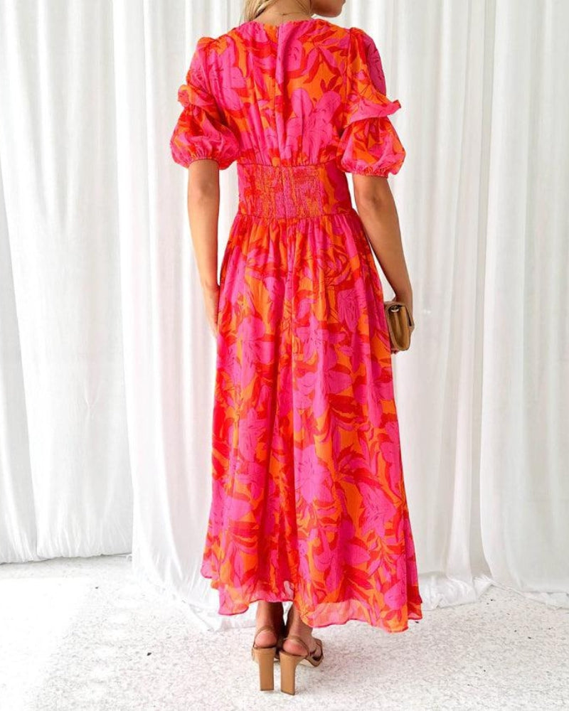 Elegant women's maxi dress with a radiant flowy design, V-neck, and puff sleeves for a stylish summer or party look.