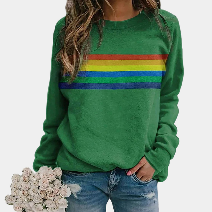 Relaxed fit women's rainbow stripe pullover sweatshirt, perfect for vibrant everyday fashion and comfort.