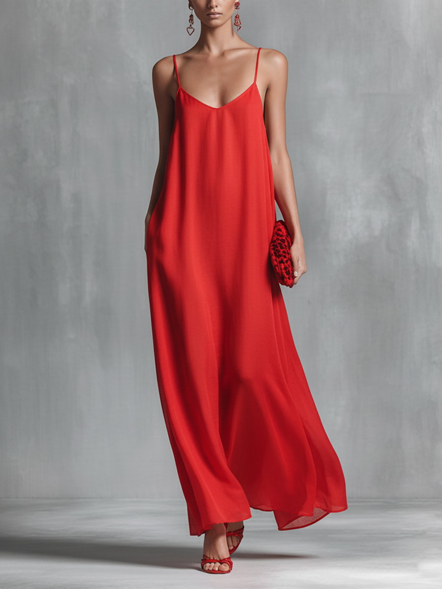 Women's red flowing V-neck maxi dress with adjustable spaghetti straps, perfect for summer casual or elegant wear.