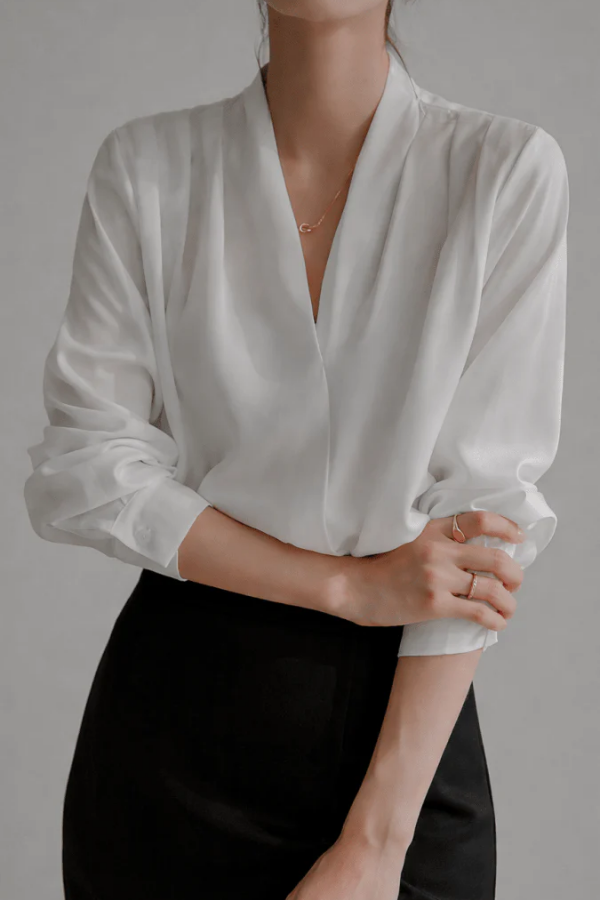 Women's refined everyday long sleeve wrap blouse. Elegant and versatile for casual chic or workwear.