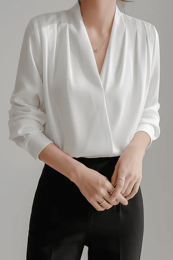 Crisp white women's long sleeve wrap blouse. Refined and versatile, ideal for elegant everyday wear & workwear.