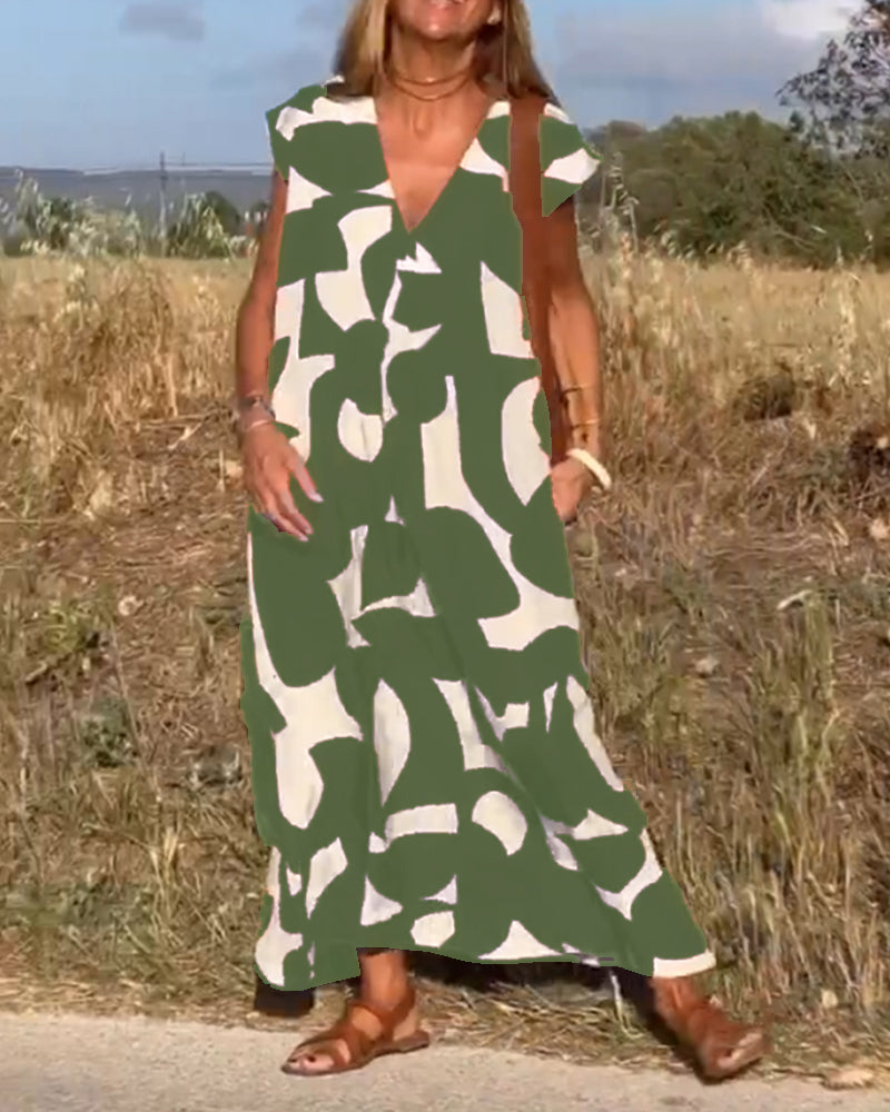 Stylish women's relaxed abstract print dress, V-neck, perfect for an effortless summer outfit.