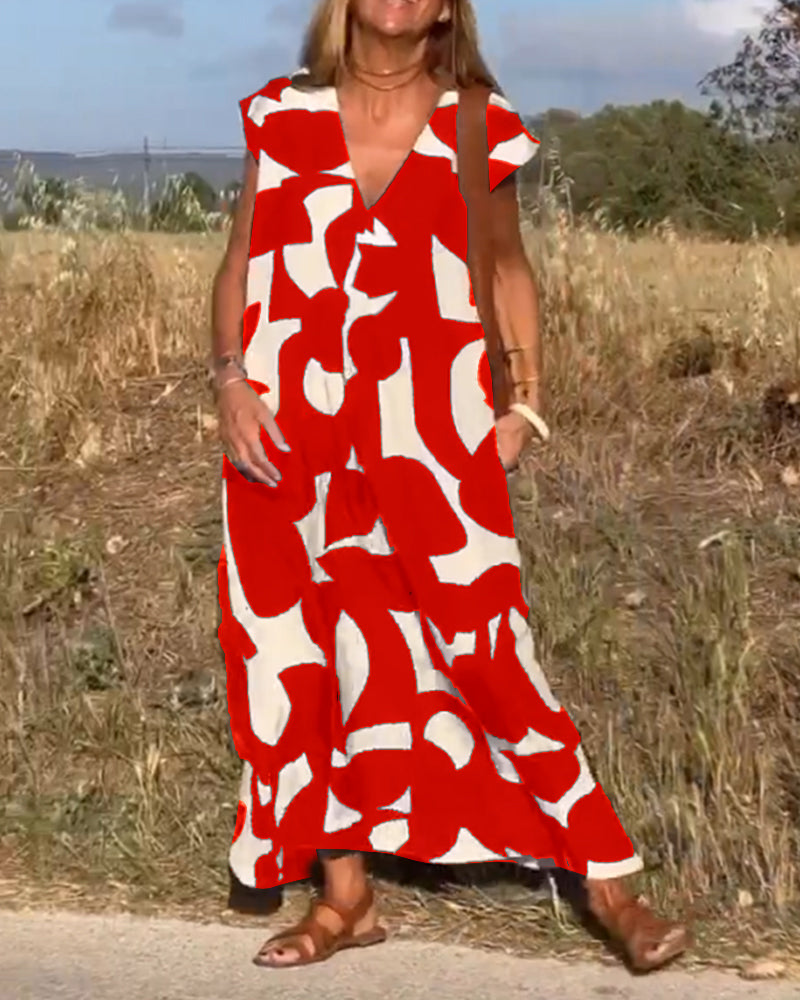 Bright abstract print women's dress, relaxed V-neck style, perfect for cheerful summer looks.