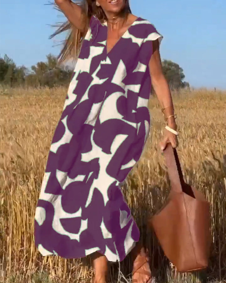 Unique abstract print women's dress, relaxed V-neck style, great for a stand-out summer outfit.
