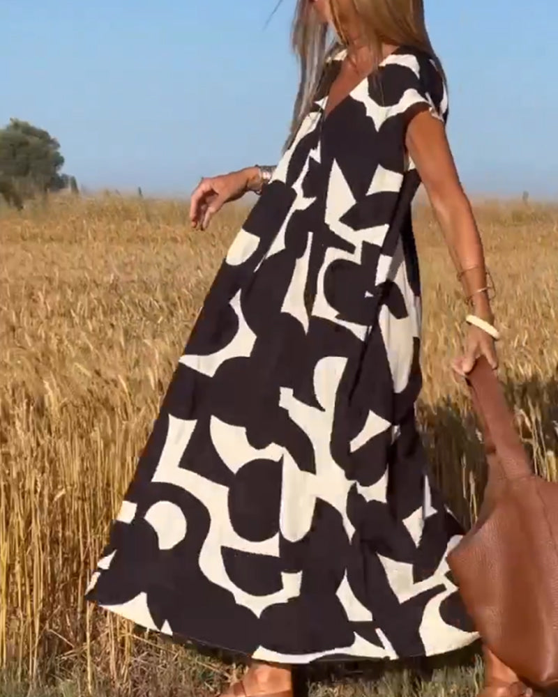 Vibrant abstract print casual dress for women, relaxed fit, ideal for summer vacation outfits.