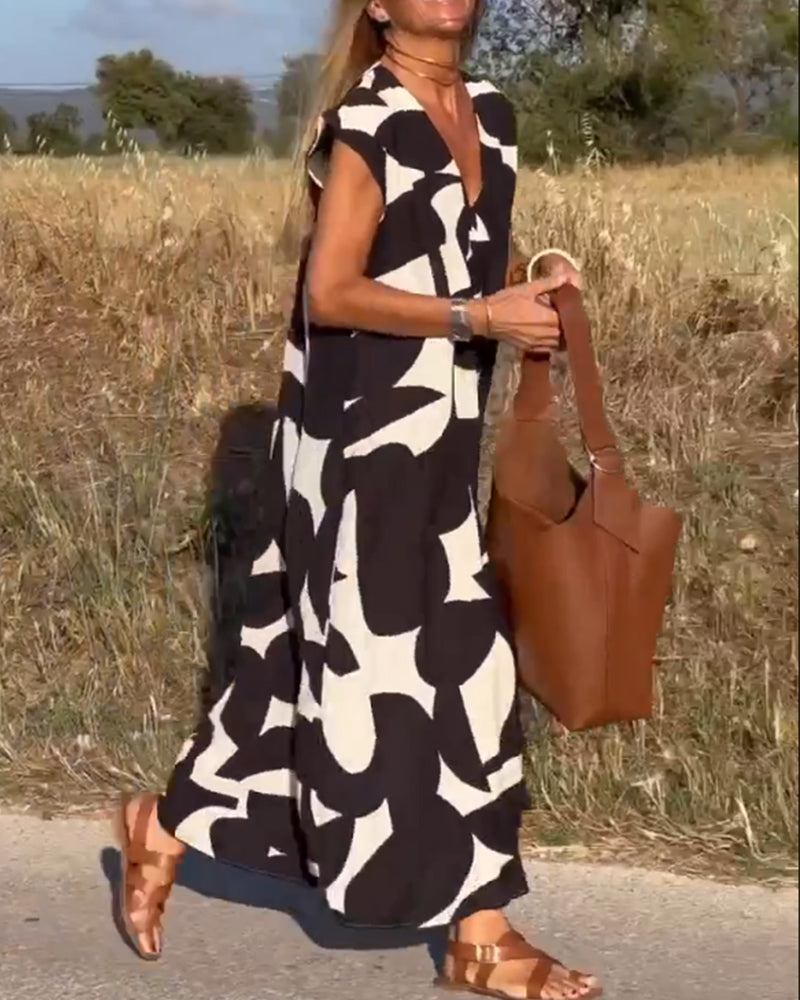 Lightweight women's summer dress, abstract print, relaxed fit V-neck for breezy fashion.