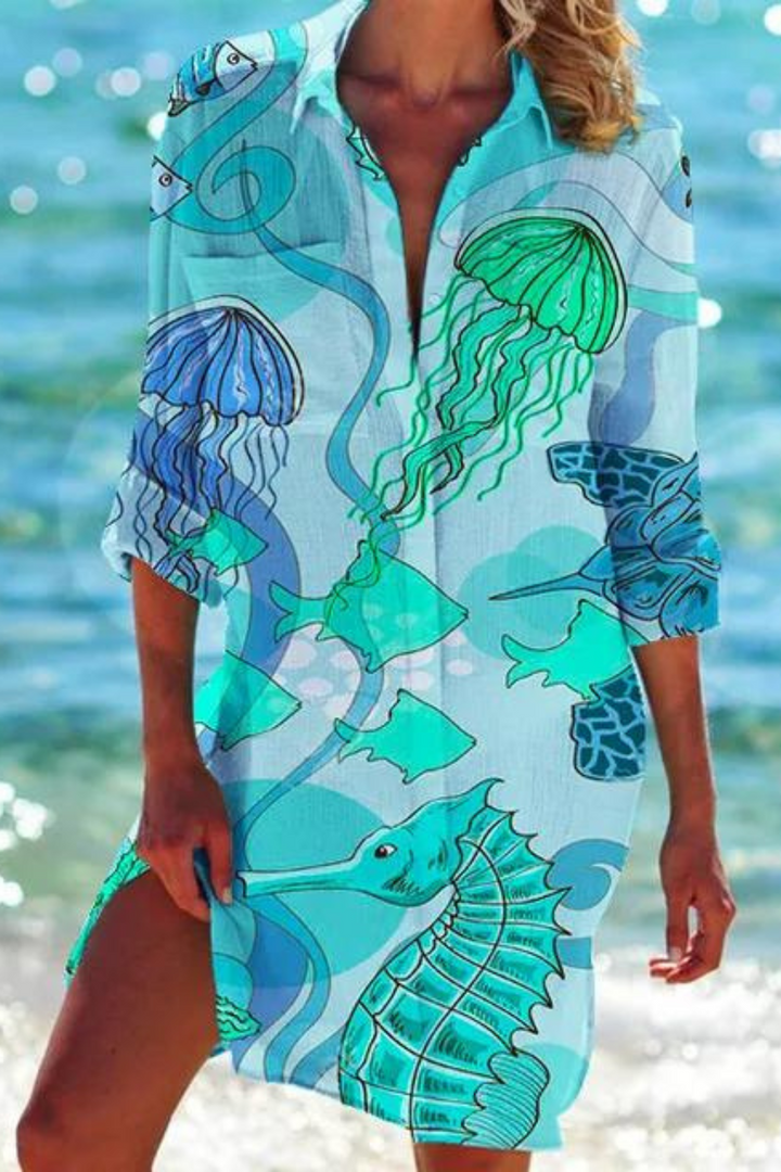 Summer women's casual beach cover up, button-down, featuring a stunning seashell & coral print. Resort fashion.