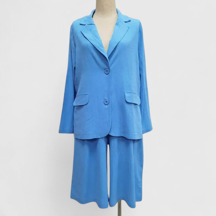 Stylish women's relaxed blazer and Bermuda shorts two-piece. Versatile resort wear for chic summer or smart casual.