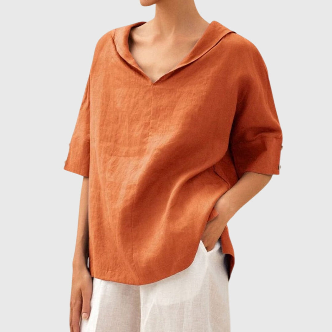 Close-up of a women's relaxed fit blouse, highlighting its soft fabric, comfortable loose fit & quality.