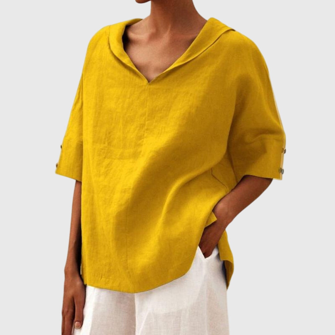 Front view of a women's relaxed fit blouse, a versatile everyday top offering stylish comfort & a loose fit.