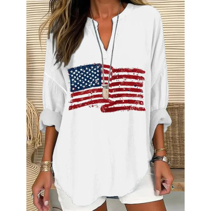 Effortless summer women's blouse with a relaxed fit, attractive split neck, and folded three-quarter sleeves.