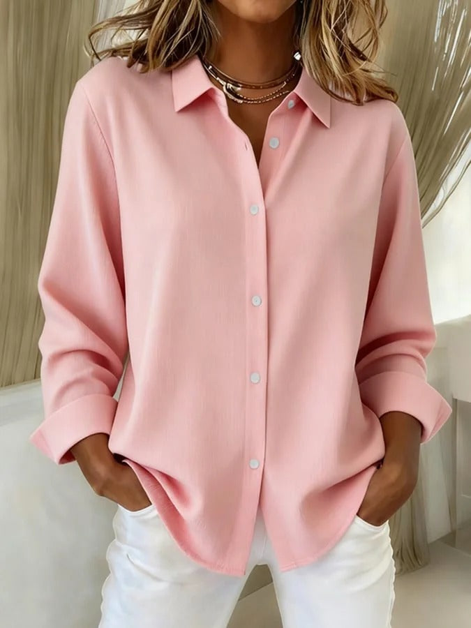 Stylish women's button down work blouse with relaxed fit & long sleeves. Ideal for professional office attire.