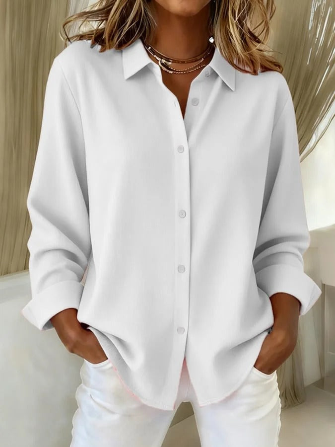 Elegant women's button down blouse, relaxed fit, long sleeve. Perfect office wear or stylish casual top.