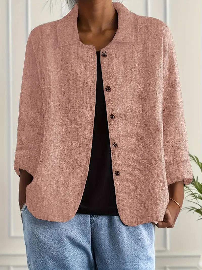 Stylish women's collared button-front top with three-quarter sleeves & relaxed fit for casual wear.