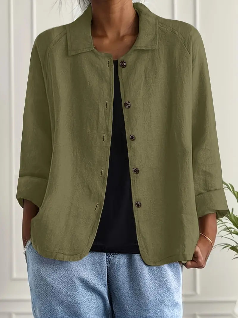 Relaxed fit women's button-front top, comfortable three-quarter sleeve, collared for versatile casual style.