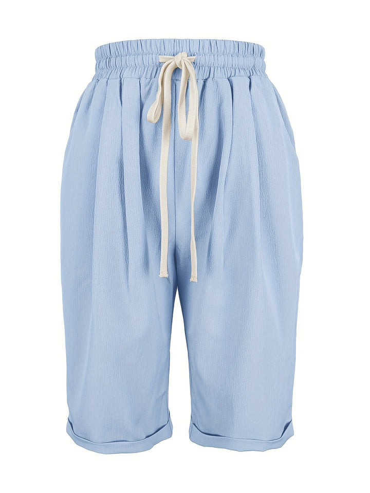 Lightweight women's capri trousers, relaxed fit, elastic waist, great for summer comfort.