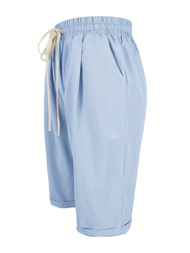 Casual women's capri trousers with elastic waist, relaxed fit for everyday summer comfort.