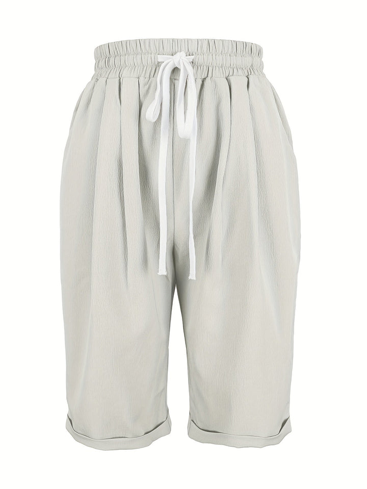 Elastic waist capri trousers for women, relaxed fit, lightweight, ideal for summer.