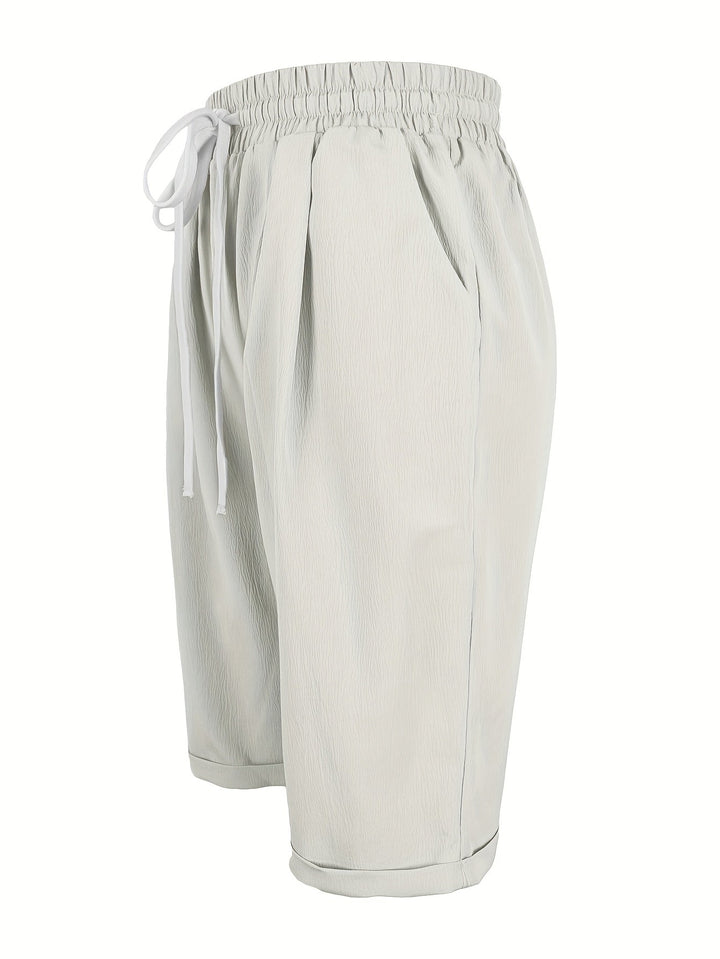Relaxed fit women's capri trousers, comfortable elastic waist, perfect for casual summer days.