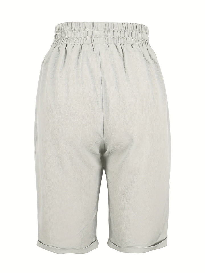 Lightweight women's relaxed fit mid-calf capri trousers, comfortable elastic waist, summer casual.