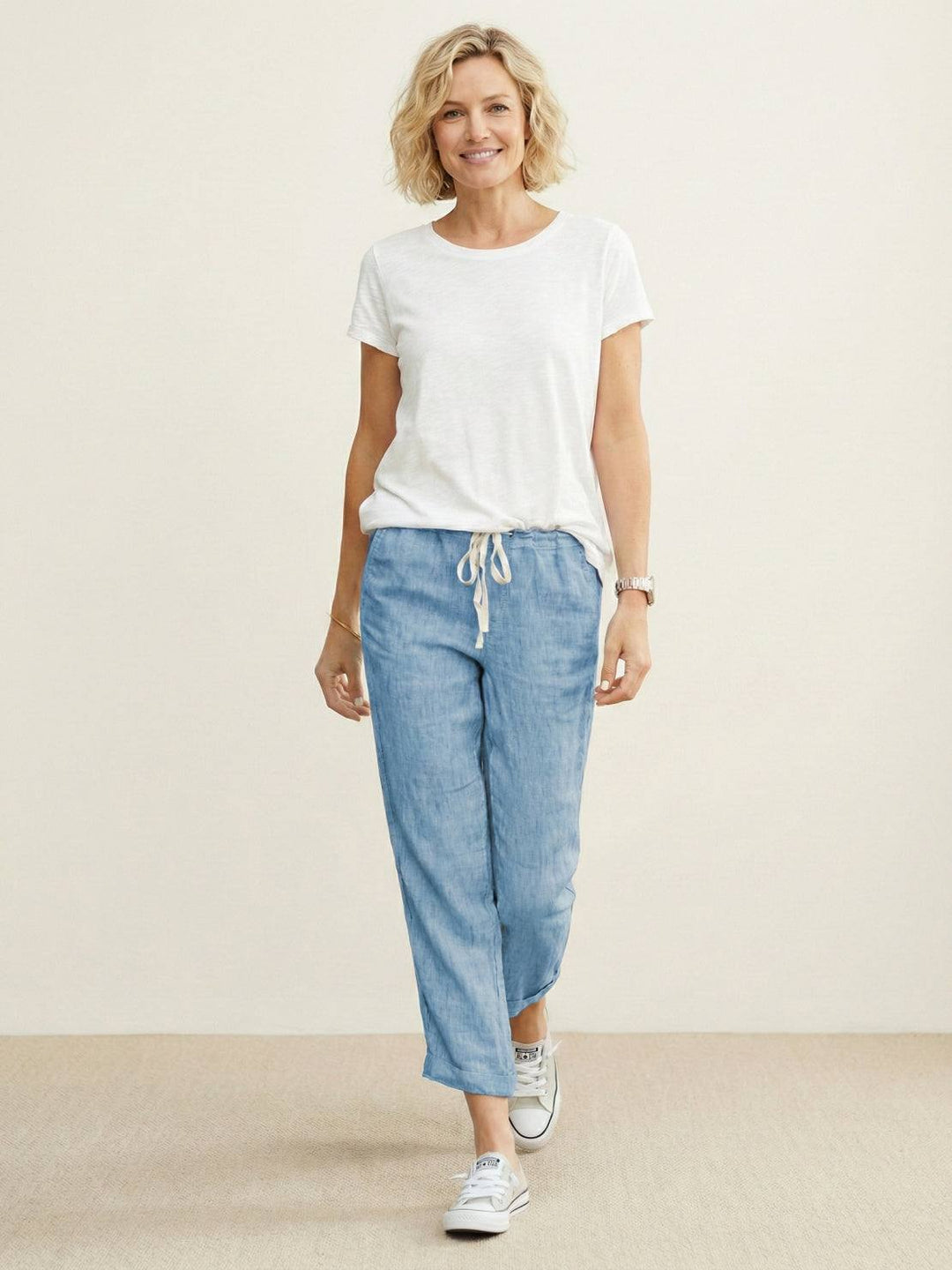 Stylish women's relaxed fit pants, cuffed hem, elastic waist for a casual look.
