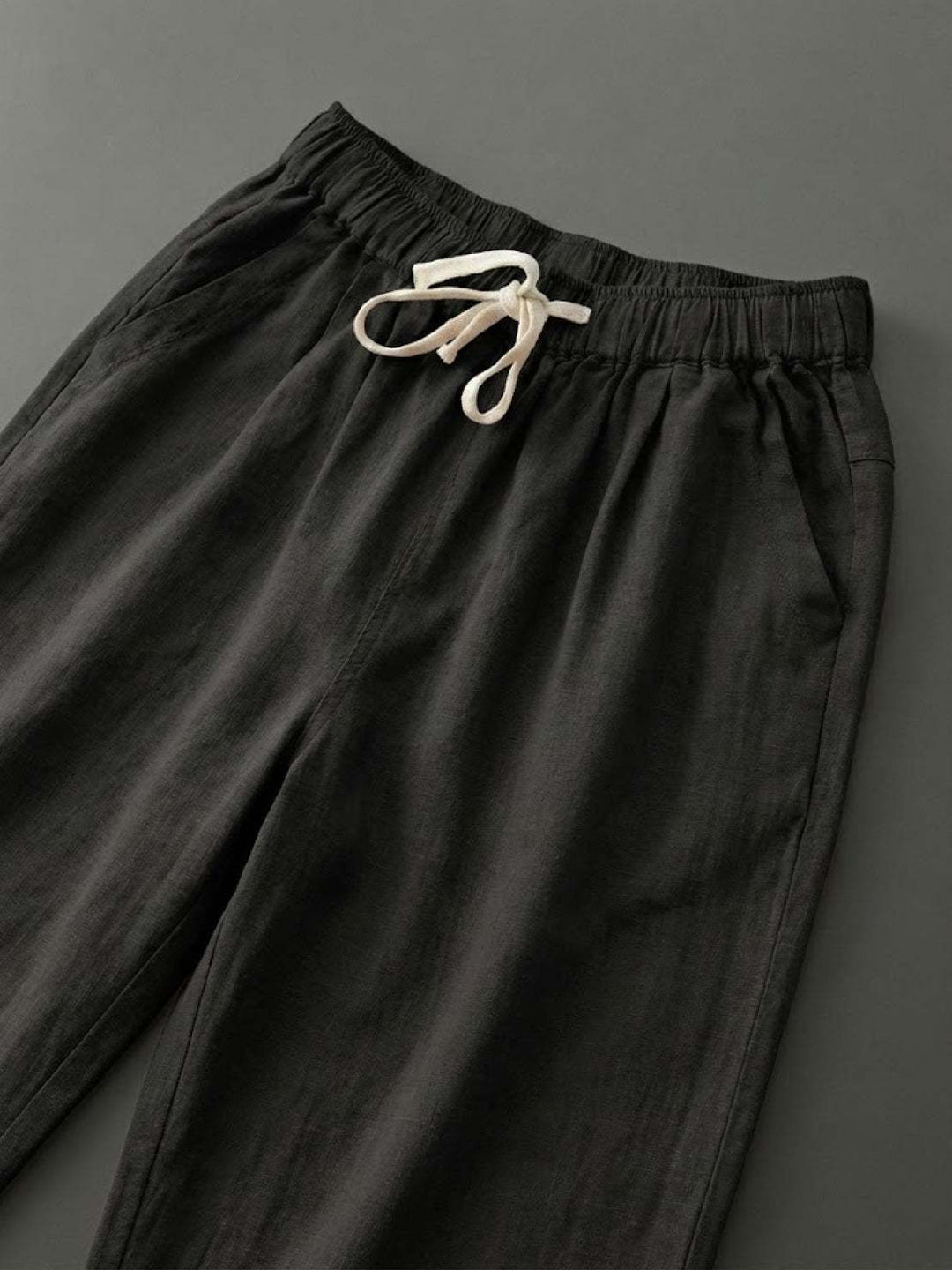 Relaxed fit women's pants with an elastic waist and stylish cuffed hem.