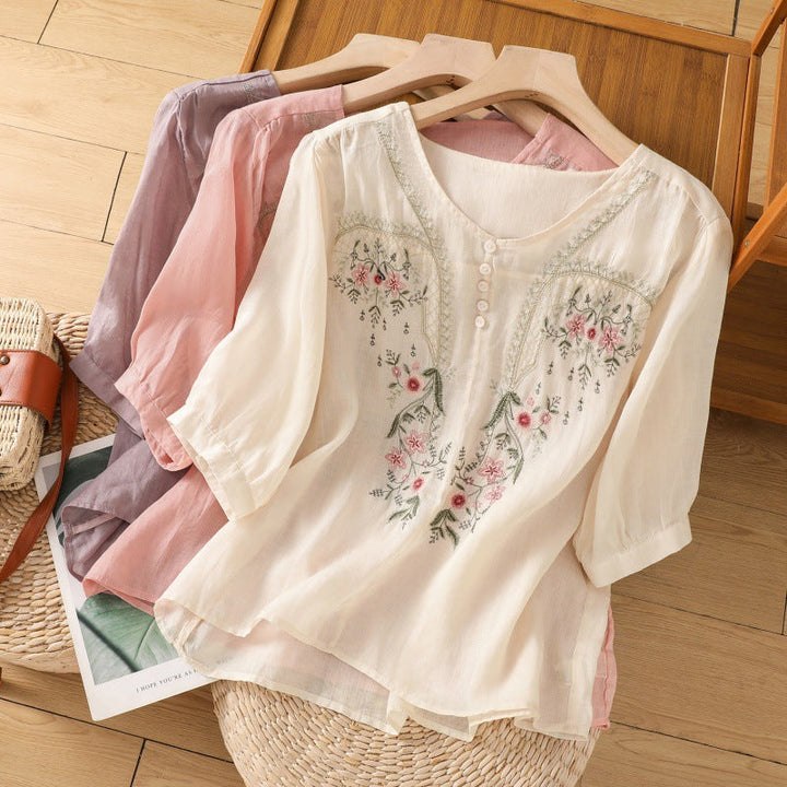 Women's relaxed fit floral embroidered blouse. Elegant V-neck, long sleeves, perfect for casual spring & summer style.