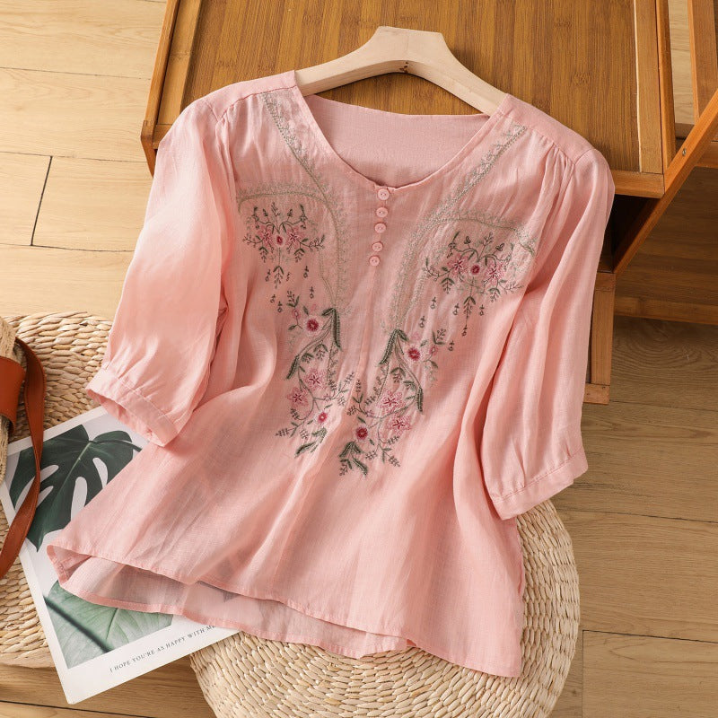 Boho chic women's blouse with intricate floral embroidery. Relaxed V-neck, long sleeve top for versatile everyday wear.