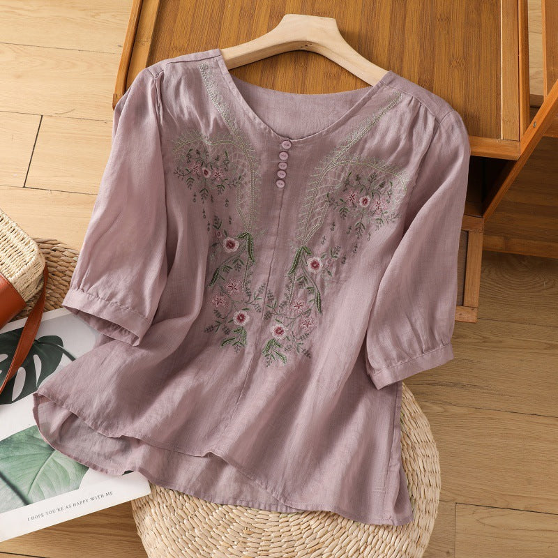 Casual women's floral embroidered shirt. Relaxed fit, long sleeve V-neck top for comfortable spring & summer fashion.