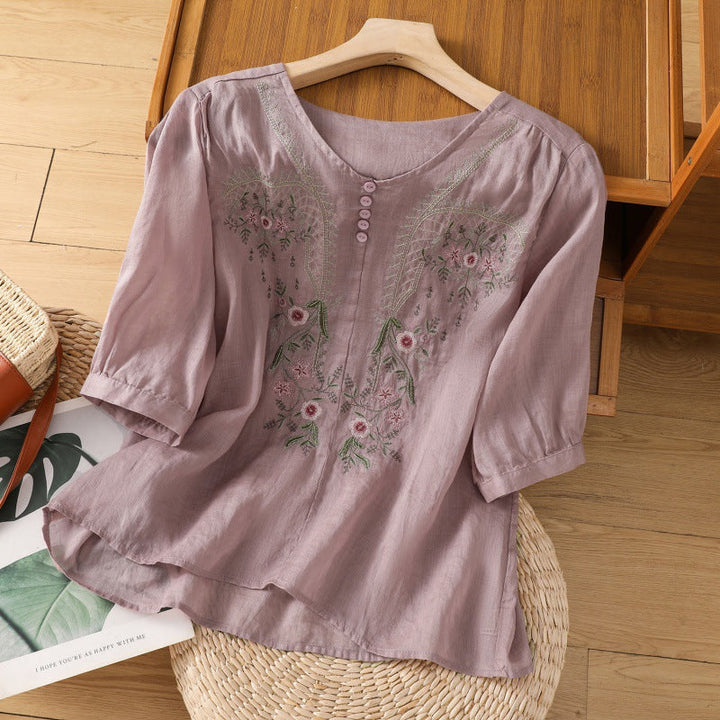 Casual women's floral embroidered shirt. Relaxed fit, long sleeve V-neck top for comfortable spring & summer fashion.