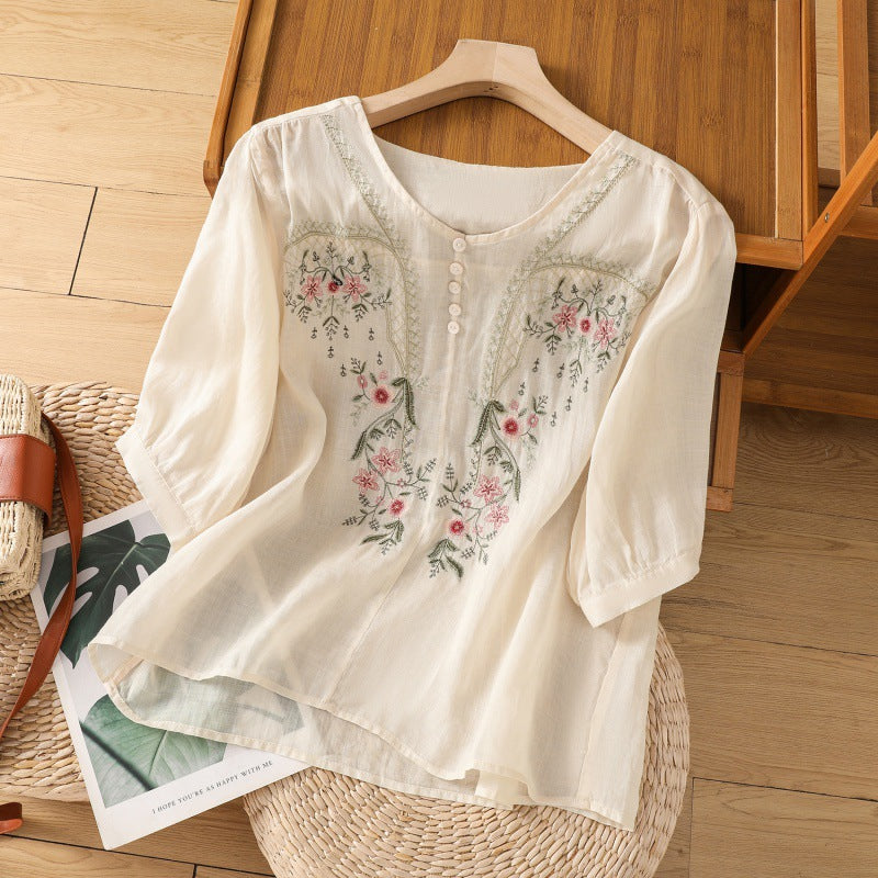 Elegant women's floral embroidered V-neck blouse. Relaxed long sleeve top, ideal for versatile spring casual wear.