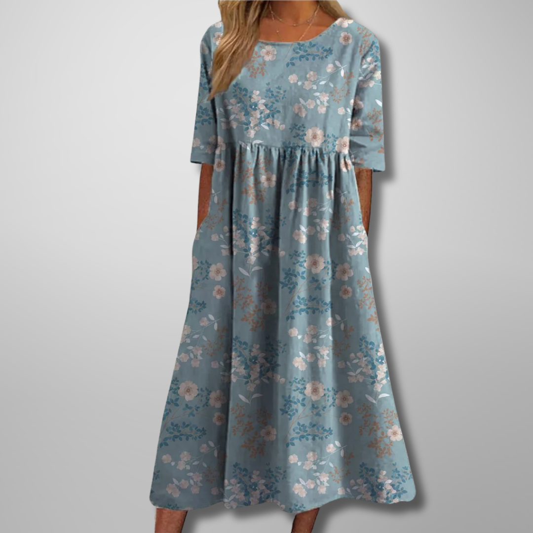 Relaxed fit women's floral midi dress, showcasing a beautiful print and comfortable design.