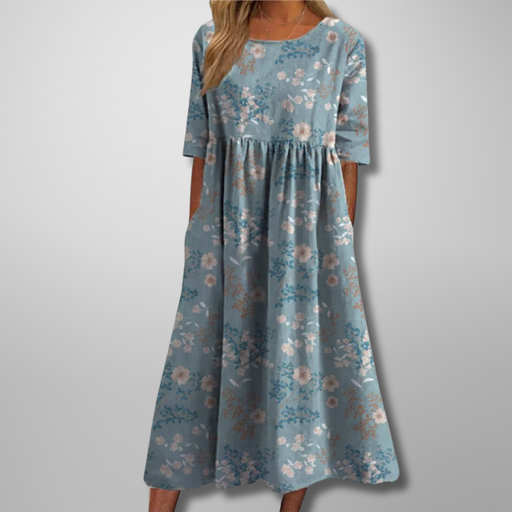 Relaxed fit women's floral midi dress, showcasing a beautiful print and comfortable design.