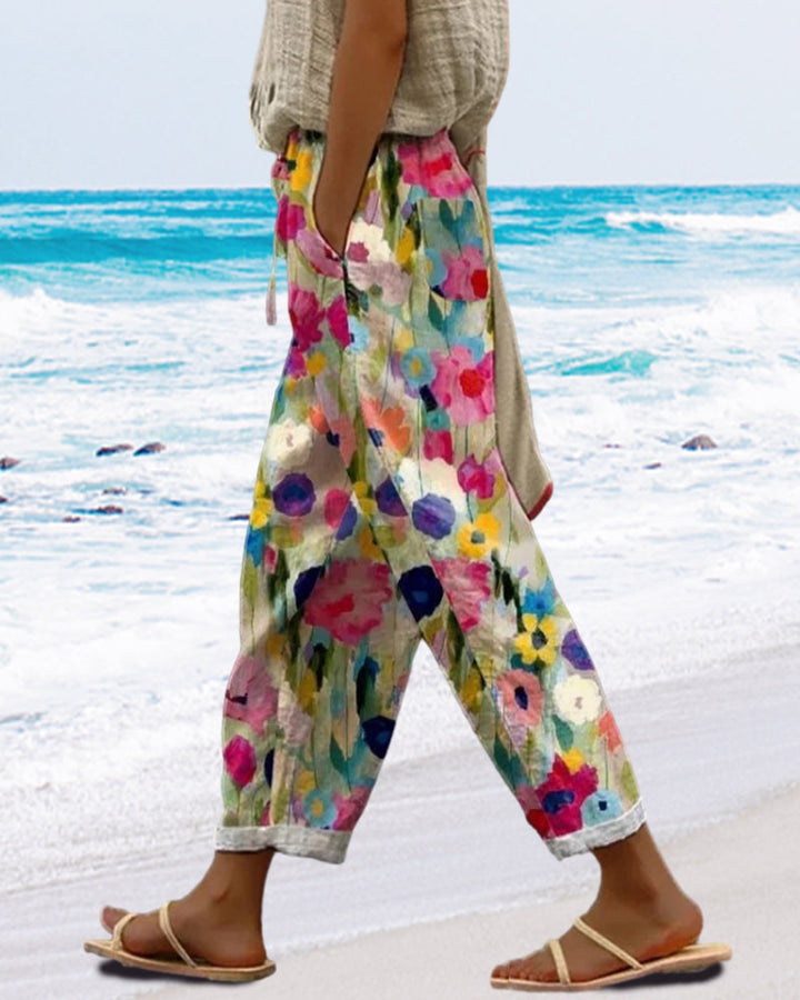 Comfortable women's relaxed fit trousers featuring an artistic floral print, great for casual elegance.
