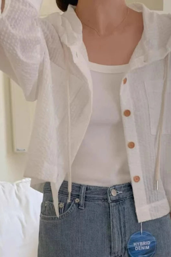 Women's relaxed fit hooded blouse, perfect for casual summer wear. Long sleeve comfort top.