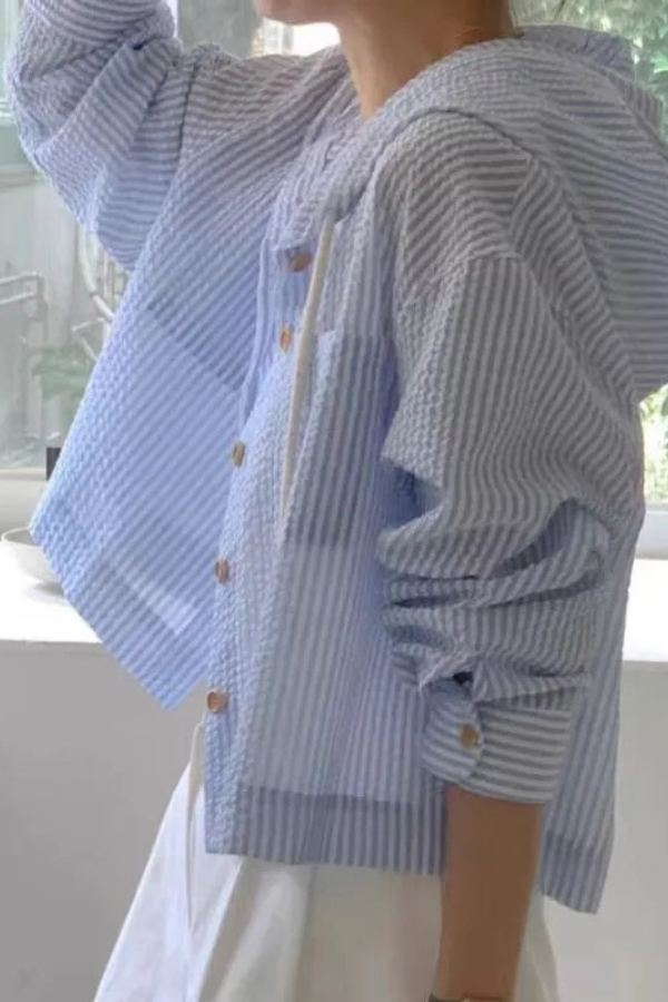 Comfortable women's long sleeve hooded blouse. Relaxed fit top, great for casual summer days.